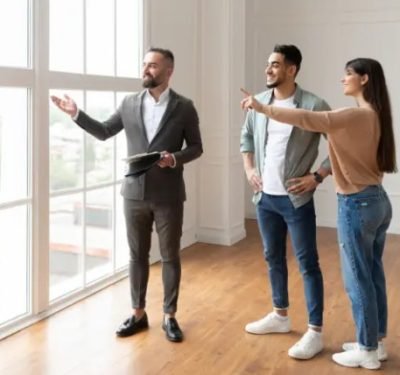 Buyer agent reviewing Paris property documents with international clients